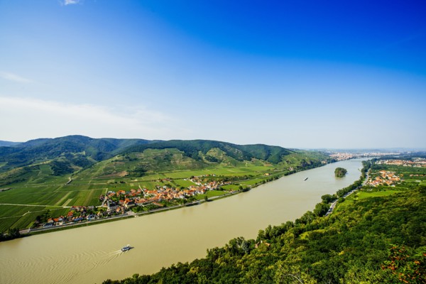 Boats on river near village