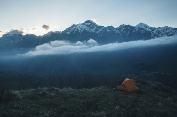 Camping tent in mountain landscape