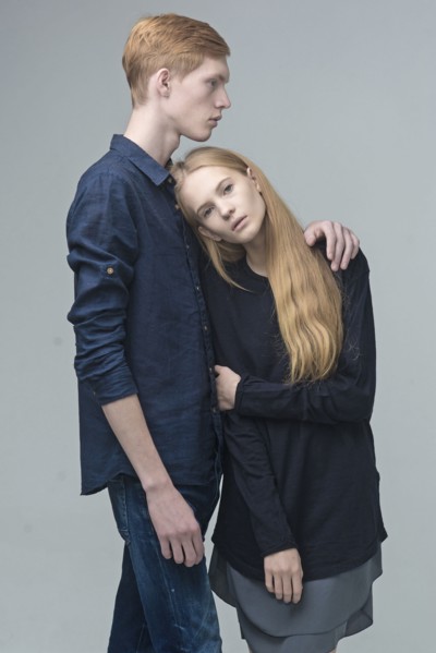 Portrait of serious Caucasian couple hugging