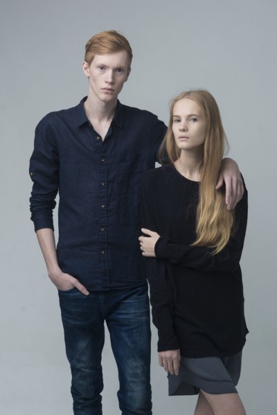 Portrait of serious Caucasian couple hugging