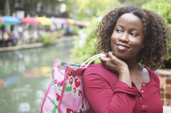 Mid adult woman carrying a shopping bag
