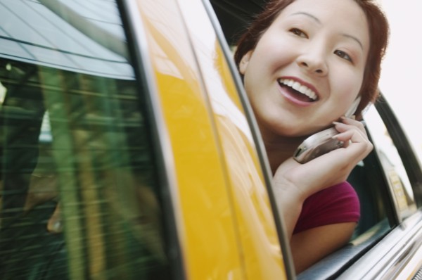 Woman looking through car window