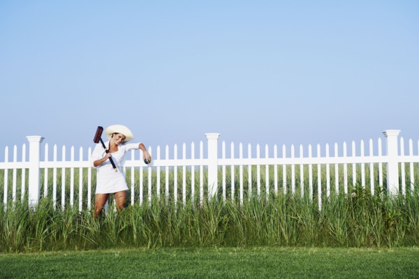 Hispanic woman holding croquet mallet
