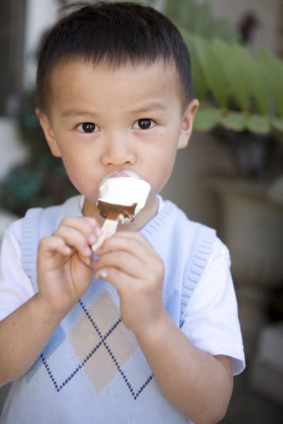 Chinese boy eating ice cream