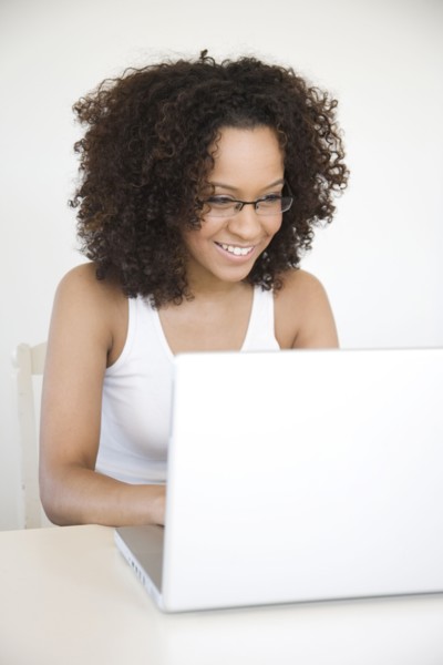 Hispanic woman using laptop