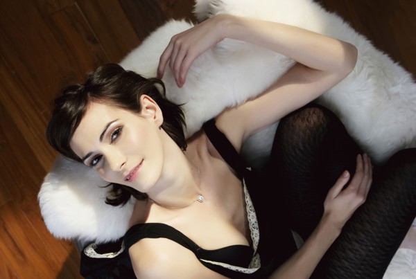 Caucasian woman laying on shag rug