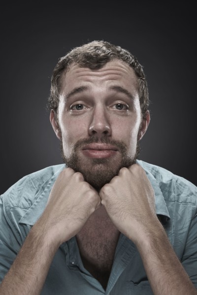 Sad man with hands on chin