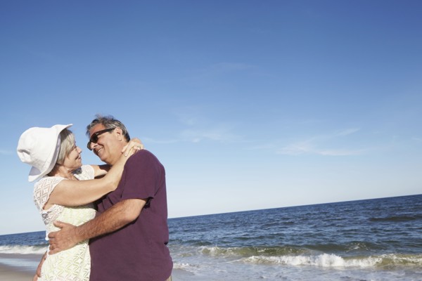 Senior couple dancing on tropical beach