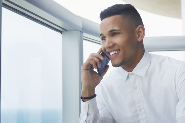 Black businessman talking on cell phone
