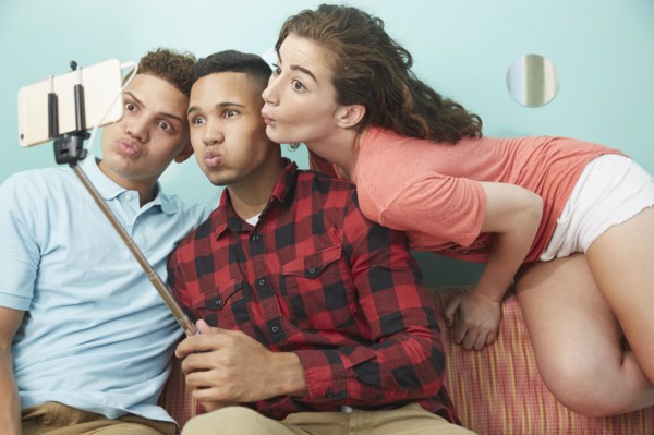 Friends making faces and taking selfie