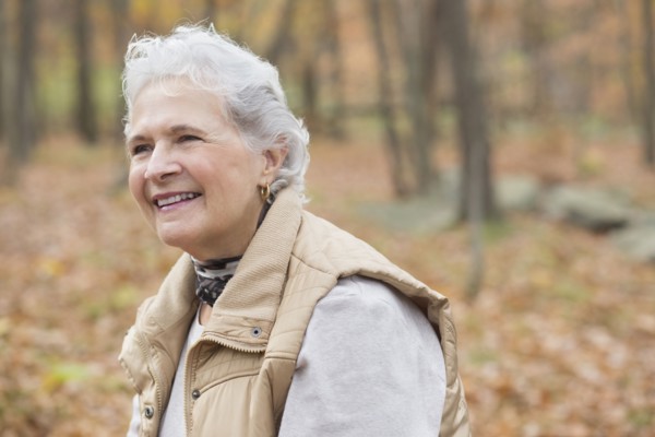 Caucasian woman smiling outdoors in autumn