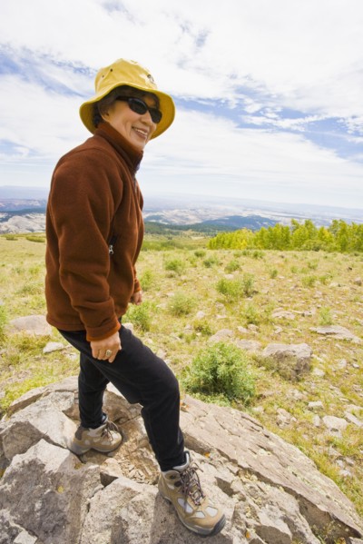 Japanese woman hiking in mountain terrain