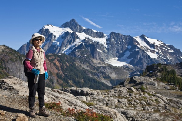 Japanese woman hiking near mountain