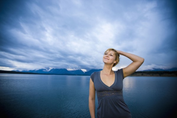 Caucasian woman standing near lake