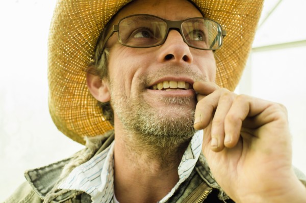 Caucasian farmer wearing straw hat outdoors