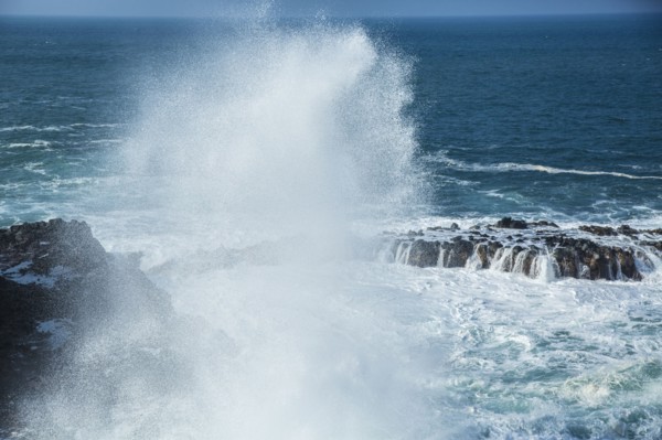 Waves crashing on rocky beach