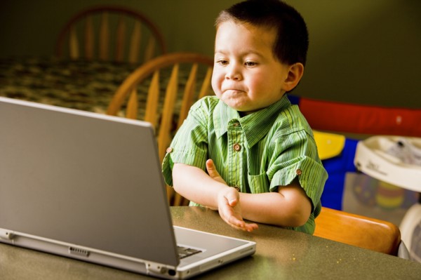 Mixed Race boy using laptop