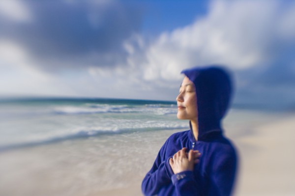 Japanese woman relaxing on beach