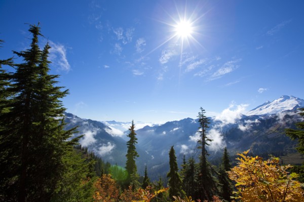 Sun over autumn mountain landscape