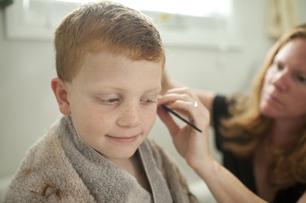 Caucasian mother giving son haircut