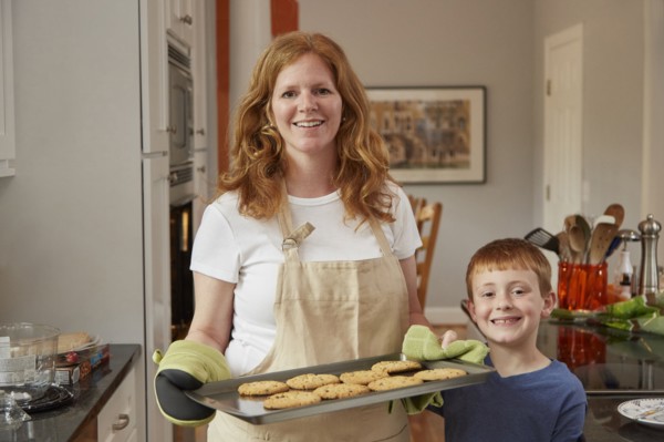 Caucasian mother and son baking cookies in kitchen