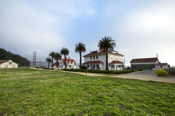 Houses and grass field near Golden Gate Bridge