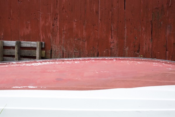 Rowboat stored upside-down at shack