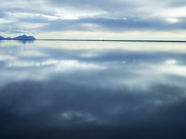 Reflection of clouds in still water