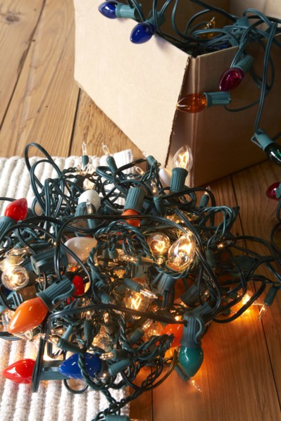 Glowing Christmas lights tangled on floor