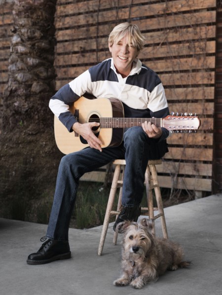 Caucasian man playing guitar