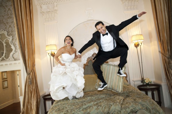 Egyptian bride jumping on bed