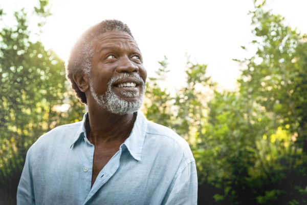Senior man smiling outdoors