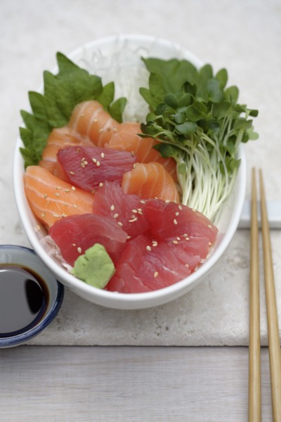 Close up of sashimi and sprouts