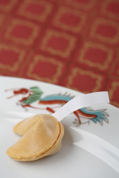 Close up of fortune cookie on plate