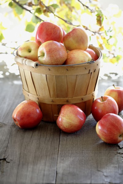 Red apples overflowing basked