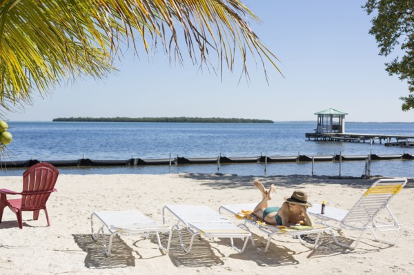 Caucasian woman relaxing on tropical beach