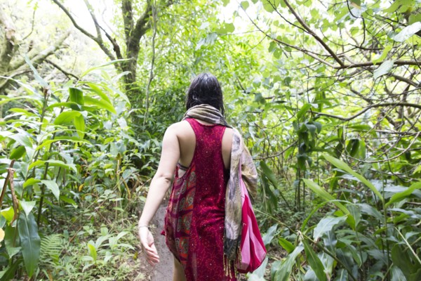 Caucasian woman walking in forest