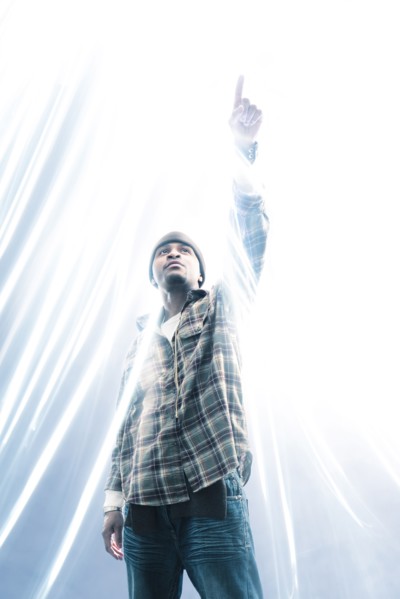 African American man pointing at light spark