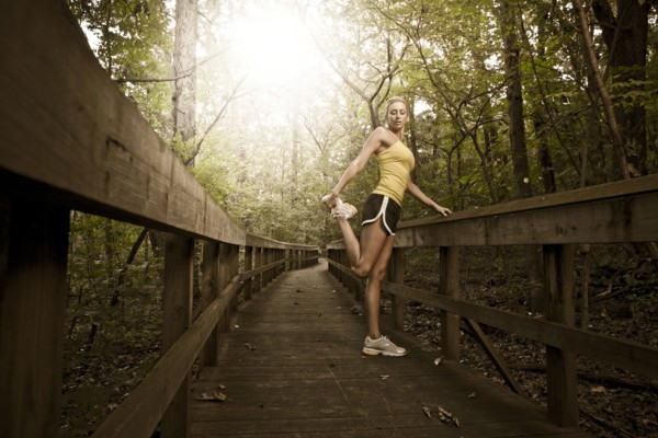 Caucasian woman stretching before exercise