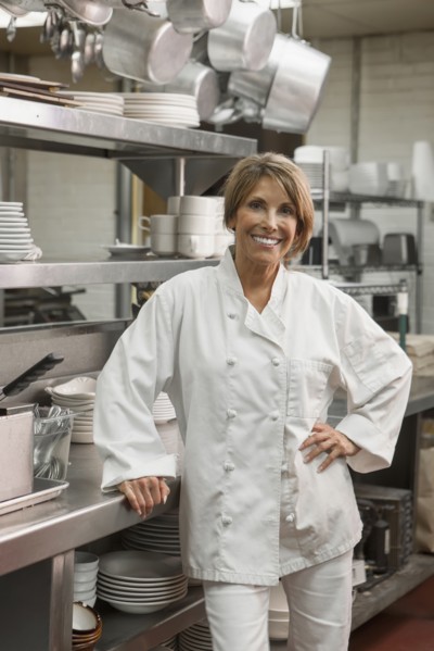 Caucasian chef standing in commercial kitchen