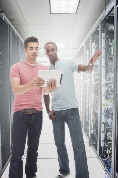 Businessmen working in server room