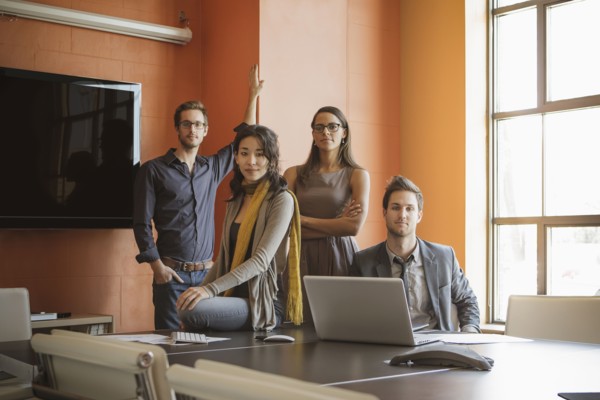 Businesspeople smiling in meeting