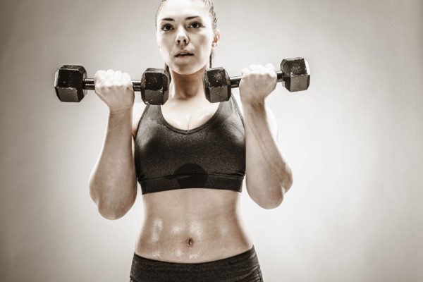Caucasian woman lifting weights