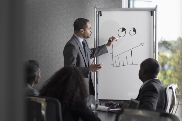 Businessman talking to colleagues in meeting