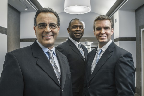 Businessmen smiling in office corridor