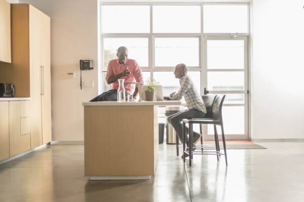 Business people talking in office kitchen