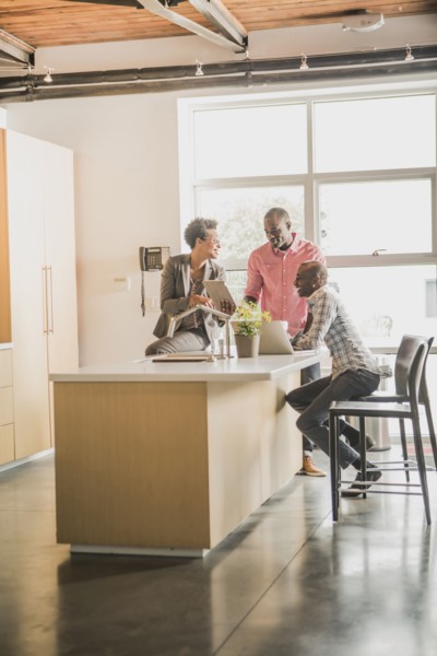Business people relaxing in office kitchen