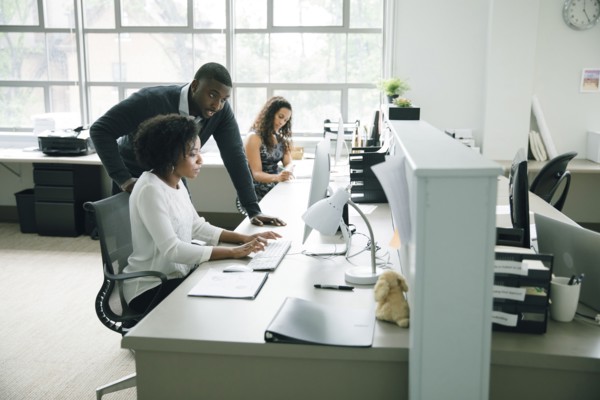 Business people using computer in office