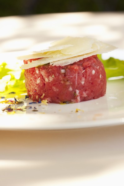 Parmesan cheese atop steak tartare