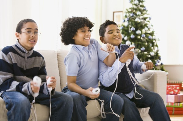 Boys playing video game at Christmas